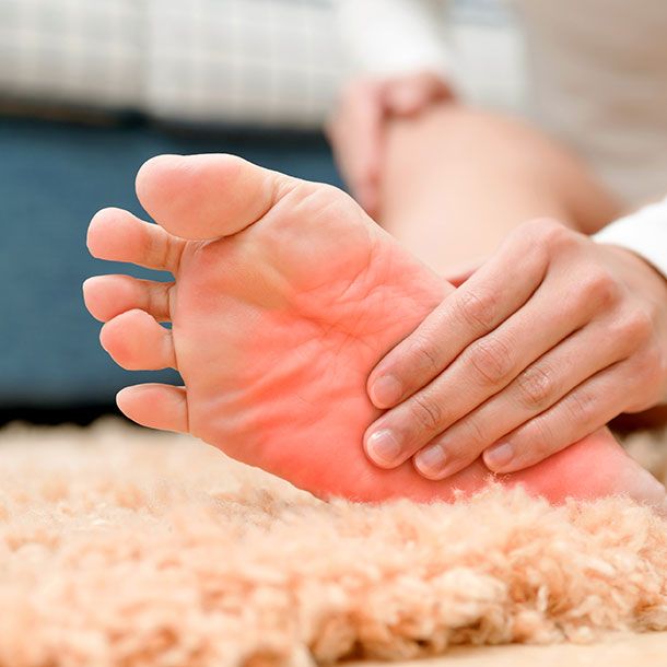 Red, inflamed soles of feet showing symptoms of diabetic nerve pain and neuropathy in diabetes