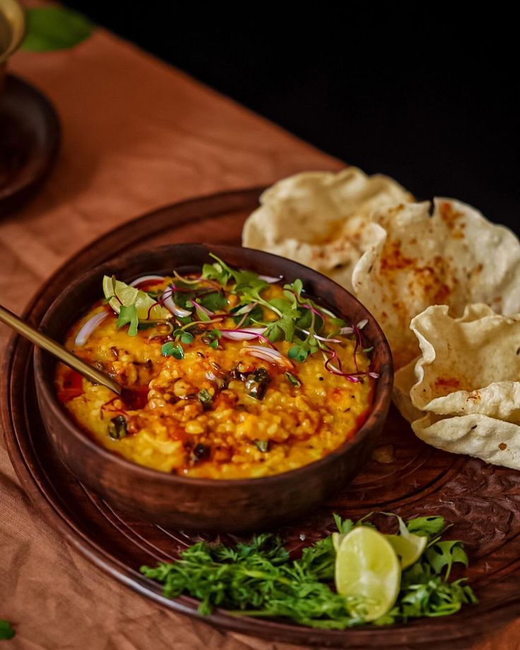 Top view of Indian millets and dals in rustic bowls—featuring foxtail millet, little millet, moong dal, and masoor dal—perfect for plant-based, diabetes-friendly meals. Aesthetic setup promoting whole grains and high-protein vegan staples for blood sugar control.
